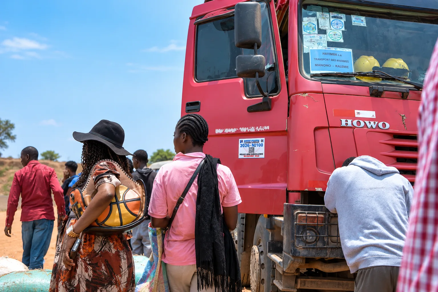 Scène de transport rural autour d’un camion HOWO
